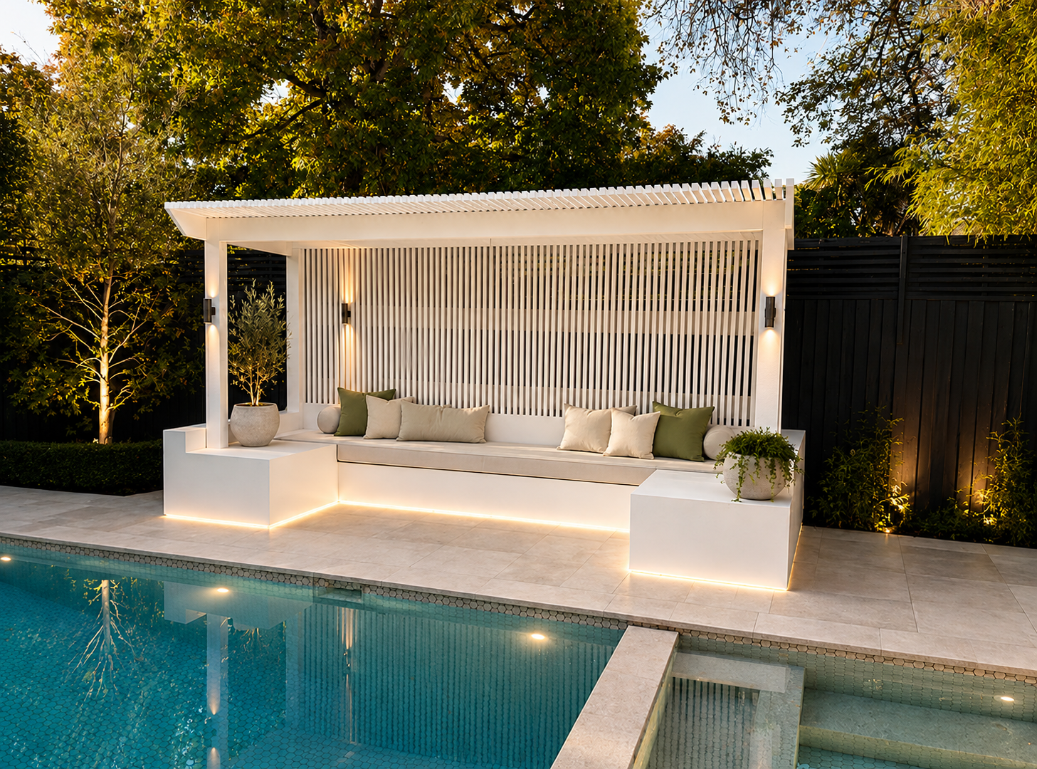 Batten pergola with integrated LED bench lighting beside a pool in Kew, built by PJR Landscaping