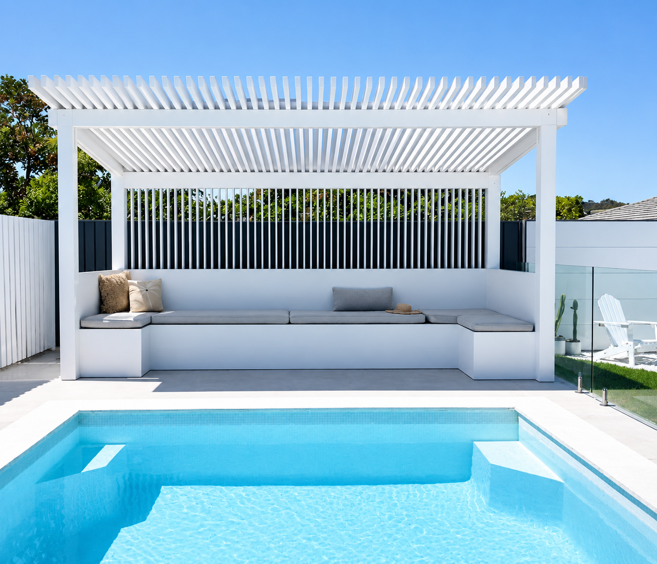 Custom poolside pergola with built-in bench seating and batten roof structure, Melbourne inner west